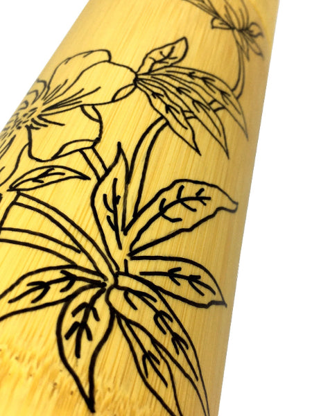 Closeup product image of bamboo container with black hand drawn floral design