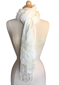 Product image of a cream white color pashmina shawl scarf on a dress form with long fringe