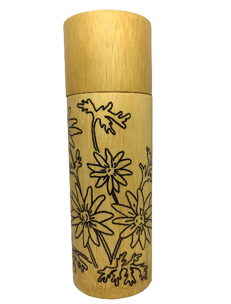 Front view image of a bamboo container with black floral hand drawn design around the container