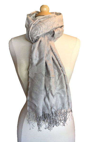 Product image of a grey bamboo pashmina scarf tied around a dress form with long fringe at the bottom