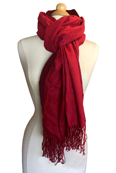 Product image of red pashmina scarf shawl wrapped on a white dress form with long fringe