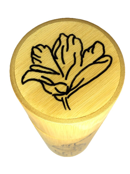 Closeup detail image of a bamboo container lid with hand drawn tulip design